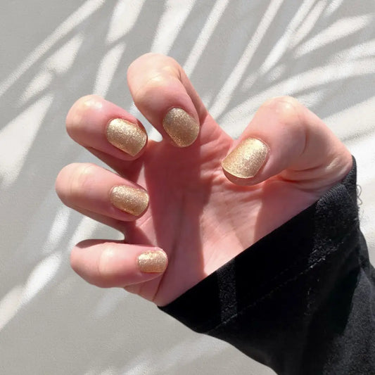 Nice and Nailed gel nail stickers with gold sparkle in Prosecco